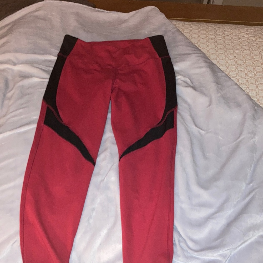 Red and Black leggings with small pocket on right waist.